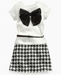 Traditional and trendy. Houndstooth check on the skirt of this dainty belted dress from Sweet Heart Rose, complimented by a decorative bow on front, complements her cute style. Traditional and trendy. Houndstooth check on the skirt of this dainty belted dress from Sweet Heart Rose, complimented by a decorative bow on front, complements her cute style.