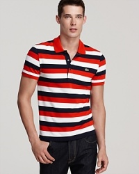 Rich in color and with a collar you can pop, this classic-fit stripe pique polo works well with jeans and shorts for a fun, smart look. Rich in color and with a collar you can pop, this classic-fit stripe pique polo works well with jeans and shorts for a fun, smart look.