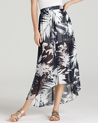 Wear the tropics all year round in this VINCE CAMUTO maxi skirt, emblazoned with a lush leaf pattern for a botanical feel. Wear the tropics all year round in this VINCE CAMUTO maxi skirt, emblazoned with a lush leaf pattern for a botanical feel.