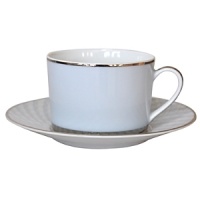 Carefully rendered in a style reminiscent of neoclassic trompe l'oeil-a French term for artwork that depicts optical illusions-a captivating geometric rosette motif traverses this elegant porcelain tea cup from Bernardaud. Delicate shades of ice blue, mother-of-pearl and gray are enhanced by a fine platinum trim and central medallion design. Carefully rendered in a style reminiscent of neoclassic trompe l'oeil-a French term for artwork that depicts optical illusions-a captivating geometric rosette motif traverses this elegant porcelain tea cup from Bernardaud. Delicate shades of ice blue, mother-of-pearl and gray are enhanced by a fine platinum trim and central medallion design.