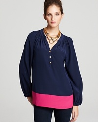 With an effortless silhouette, this Lilly Pulitzer blouse is as easy as a tee, but infinitely more chic as crisp color blocking defines the fluid style. With an effortless silhouette, this Lilly Pulitzer blouse is as easy as a tee, but infinitely more chic as crisp color blocking defines the fluid style.