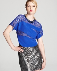 Lace and silk meet on this Nanette Lepore top for a new-season take on femininity that flaunts modern edge. Lace and silk meet on this Nanette Lepore top for a new-season take on femininity that flaunts modern edge.