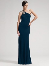 This stunning one-shoulder style is accessorized with lavishly beaded straps that cross the back. Fluid matte jersey knit Side zipper Fully lined About 64 from shoulder to hem Rayon; spot clean only Made in USA of imported fabricOUR FIT MODEL RECOMMENDS ordering true size.. This stunning one-shoulder style is accessorized with lavishly beaded straps that cross the back. Fluid matte jersey knit Side zipper Fully lined About 64 from shoulder to hem Rayon; spot clean only Made in USA of imported fabricOUR FIT MODEL RECOMMENDS ordering true size..