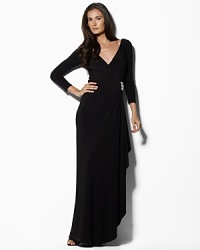 Effortlessly stunning in a glamorous floor-length silhouette with an elegant knot detail at the front, this gown is rendered in light, airy matte jersey for graceful movement. Effortlessly stunning in a glamorous floor-length silhouette with an elegant knot detail at the front, this gown is rendered in light, airy matte jersey for graceful movement.