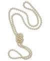A must-have for every wardrobe from the island of Mallorca, Spain. This classic endless rope necklace features white round organic man-made pearls (8 mm) and can be worn a multitude of ways to enhance any outfit. Approximate length: 60 inches.