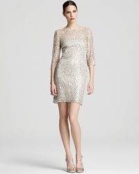 This exquisite Kay Unger lace dress is flecked with sparkling sequins for a dose of glamour. This exquisite Kay Unger lace dress is flecked with sparkling sequins for a dose of glamour.