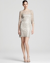 This exquisite Kay Unger lace dress is flecked with sparkling sequins for a dose of glamour.