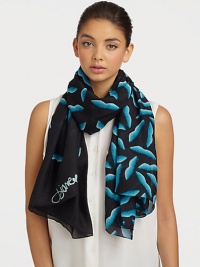 A smooth silk style that features a graphic, abstract lip print. SilkAbout 40 X 67Dry cleanImported 