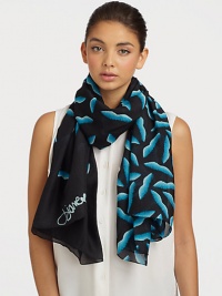 A smooth silk style that features a graphic, abstract lip print. SilkAbout 40 X 67Dry cleanImported A smooth silk style that features a graphic, abstract lip print. SilkAbout 40 X 67Dry cleanImported