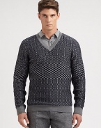 A well-knitted wool pullover sweater is printed in a textural, geometric pattern for a look that exudes modern elegance.V-neckRibbed knit cuffs and hemWoolMachine washImported