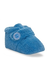 This super cute bootie is crafted in twinface sheepskin, with strap upper and logo button detail. This super cute bootie is crafted in twinface sheepskin, with strap upper and logo button detail.