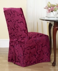 An effortless update and perfect furniture protector, the printed Scroll dining room chair cover from Sure Fit features a draped skirt with back ties for a sleek fit over any style furniture. An effortless update and perfect furniture protector, the printed Scroll dining room chair cover from Sure Fit features a draped skirt with back ties for a sleek fit over any style furniture.