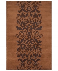 Play with patterns! Wake up your decor with Momeni's irresistibly contemporary rug. A vintage-inspired motif of plumes and blooms adorns this brown wool rug, hand-tufted for texture and superior softness. Play with patterns! Wake up your decor with Momeni's irresistibly contemporary rug. A vintage-inspired motif of plumes and blooms adorns this brown wool rug, hand-tufted for texture and superior softness.