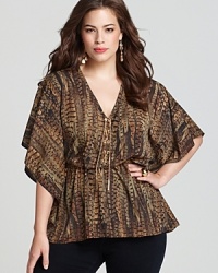 Try out this season's tribal trend in this MICHAEL Michael Kors Plus top, finished with flutter sleeves and a gold-chain tie for an elegant look with exotic attitude. Try out this season's tribal trend in this MICHAEL Michael Kors Plus top, finished with flutter sleeves and a gold-chain tie for an elegant look with exotic attitude.