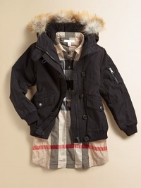 Luxurious golden fox fur trims the hood of this bomber-style parka that lets her enjoy winter while staying warm.Hood with removable golden fox fur trimButton neck tabShoulder epaulettesHidden zip close under button placketZip pocket on one sleeveRibbed knit cuffs and waistFront flap pocketsFully linedCotton/nylonMachine washImportedFur origin: Finland Please note: Number of buttons may vary depending on size ordered. Luxurious golden fox fur trims the hood of this bomber-style parka that lets her enjoy winter while staying warm.Hood with removable golden fox fur trimButton neck tabShoulder epaulettesHidden zip close under button placketZip pocket on one sleeveRibbed knit cuffs and waistFront flap pocketsFully linedCotton/nylonMachine washImportedFur origin: Finland Please note: Number of buttons may vary depending on size ordered.