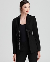 Sequin lapels shimmer against an impeccably tailored MICHAEL Michael Kors jacket, taking the 9-to-5 staple after hours. Sequin lapels shimmer against an impeccably tailored MICHAEL Michael Kors jacket, taking the 9-to-5 staple after hours.