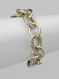 Extra large and extra lovely, this bold bracelet combines smooth 18k gold oval links with sterling silver cable links for a classic look with extra character. Sterling silver and 18k yellow gold Length, about 7½ Hidden spring clip clasp Made in USA Extra large and extra lovely, this bold bracelet combines smooth 18k gold oval links with sterling silver cable links for a classic look with extra character. Sterling silver and 18k yellow gold Length, about 7½ Hidden spring clip clasp Made in USA