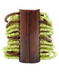 Inspire your look with something a little exotic. Kenneth Cole New York's African-inspired bracelet combines brown and lime-colored seed beads and a magnetic wooden resin slide clasp. Bracelet stretches to fit wrist. Approximate diameter: 2-1/2 inches. Inspire your look with something a little exotic. Kenneth Cole New York's African-inspired bracelet combines brown and lime-colored seed beads and a magnetic wooden resin slide clasp. Bracelet stretches to fit wrist. Approximate diameter: 2-1/2 inches.