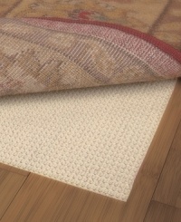 Extend the life of your rug with the Sure Grip Rug Pad. Designed to keep your rug in place, the rug pad prevents floor scratches and can be used on any hard surface. Consistent thickness throughout its construction makes for a smooth, wrinkle-free area rug that's easy to vacuum. Simply cut the pad with scissors to fit the exact shape and size of your rug! Extend the life of your rug with the Sure Grip Rug Pad. Designed to keep your rug in place, the rug pad prevents floor scratches and can be used on any hard surface. Consistent thickness throughout its construction makes for a smooth, wrinkle-free area rug that's easy to vacuum. Simply cut the pad with scissors to fit the exact shape and size of your rug!