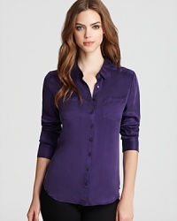 Timeless elegance become you with this sultry silk Guess blouse--the luxe-touch button down that stands out from your classic whites. Timeless elegance become you with this sultry silk Guess blouse--the luxe-touch button down that stands out from your classic whites.