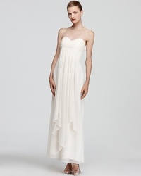 A vision in warm winter white, Laundry by Shelli Segal's strapless dress feels feminine with an empire waist and pretty pleating. A vision in warm winter white, Laundry by Shelli Segal's strapless dress feels feminine with an empire waist and pretty pleating.