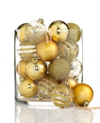 A favorite from one year to the next, Kurt Adler's shatterproof ball ornaments mix stripes and swirls of glitter with matte and shiny finishes, all in brilliant gold. A favorite from one year to the next, Kurt Adler's shatterproof ball ornaments mix stripes and swirls of glitter with matte and shiny finishes, all in brilliant gold.