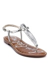 Look fabulous poolside in these metallic snake printed t-strap sandals.