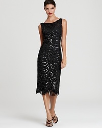 Tadashi Shoji channels the classic glamour of the 20's with this sequin embellished dress, finished with a sweet scalloped hem. Tadashi Shoji channels the classic glamour of the 20's with this sequin embellished dress, finished with a sweet scalloped hem.