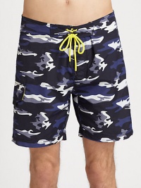 Classic, camo print adorns these swim trunks shaped in quick-drying nylon, with a drawstring waist for an easy-fit.Drawstring tie waistSide cargo pocketInseam, about 9NylonMachine washImported