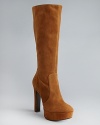 Suede sophistication reaches new heights in Via Spiga's sensational platform boots, with trend-right almond toes.