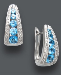 Traditional hoops in bold, blue hues. Classic J-hoop earrings receive a sparkling touch with round-cut blue topaz (1-1/2 ct. t.w.), round-cut diamonds (1/10 ct. t.w.), and a polished sterling silver setting. Approximate diameter: 1/2 inch. Traditional hoops in bold, blue hues. Classic J-hoop earrings receive a sparkling touch with round-cut blue topaz (1-1/2 ct. t.w.), round-cut diamonds (1/10 ct. t.w.), and a polished sterling silver setting. Approximate diameter: 1/2 inch.