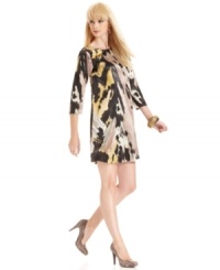 A deep V-backline adds eye-catching appeal to this MM Couture painterly-print shift dress -- pair it with stiletto booties for an edgy look! A deep V-backline adds eye-catching appeal to this MM Couture painterly-print shift dress -- pair it with stiletto booties for an edgy look!