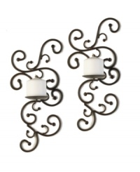 Welcome in brilliance. Striking vine-inspired sconces deck the walls of your home, splashing candlelight on the walls and defining the space with a romantic metal design. Welcome in brilliance. Striking vine-inspired sconces deck the walls of your home, splashing candlelight on the walls and defining the space with a romantic metal design.