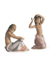 Slipping a single blossom in her hair, the Tropical Flower figurine has a sense of peace that can only come from living by the ocean. Handmade and glazed in Lladro porcelain. Shown right. Slipping a single blossom in her hair, the Tropical Flower figurine has a sense of peace that can only come from living by the ocean. Handmade and glazed in Lladro porcelain. Shown right.