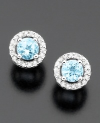 Elevate your style with twinkling round-cut aquamarine (3/8 ct. t.w.) stud earrings surrounded by round-cut diamonds (1/10 ct. t.w.). Set in 14k white gold.