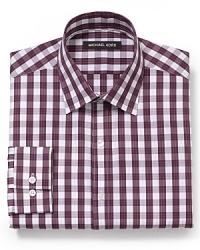 The always potent gingham check pattern gets a boost from Michael Kors in this swank dress shirt, featuring a comfortable fit and crisp cotton. The always potent gingham check pattern gets a boost from Michael Kors in this swank dress shirt, featuring a comfortable fit and crisp cotton.