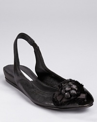 A ballet-inspired style is re-imagined in a slingback silhouette, dressed up with a satin flower detail on a dainty peep toe. From Vera Wang Lavender Label. A ballet-inspired style is re-imagined in a slingback silhouette, dressed up with a satin flower detail on a dainty peep toe. From Vera Wang Lavender Label.