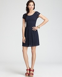 Ladylike eyelet decorates a knit Aqua dress touting the season's must-have pleated skirt for a delightful daytime look. Ladylike eyelet decorates a knit Aqua dress touting the season's must-have pleated skirt for a delightful daytime look.