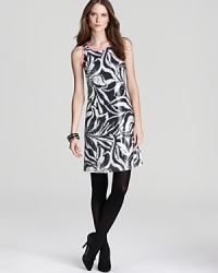 Draped in dazzling sequins and chock-full of chic, this Lilly Pulitzer dress captivates at cocktail hour with a statement abstract print. Amp up the shine factor with sleek silver accents and ignite the night. Draped in dazzling sequins and chock-full of chic, this Lilly Pulitzer dress captivates at cocktail hour with a statement abstract print. Amp up the shine factor with sleek silver accents and ignite the night.