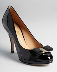 Salvatore Ferragamo creates the perfect day-to-night pumps in a modern, platform silhouette in chic patent with signature gold tone bow accents. Salvatore Ferragamo creates the perfect day-to-night pumps in a modern, platform silhouette in chic patent with signature gold tone bow accents.