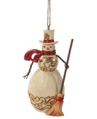 A classic snowman, complete with a carrot nose and two eyes made out of (what looks like) coal, this charming Jim Shore ornament will stay cool season after season. A classic snowman, complete with a carrot nose and two eyes made out of (what looks like) coal, this charming Jim Shore ornament will stay cool season after season.