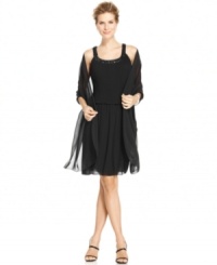 Patra elevates a shorter silhouette with the elegance of a full gown, dressing it up with a sheer shawl and a sparkling beaded neckline. Patra elevates a shorter silhouette with the elegance of a full gown, dressing it up with a sheer shawl and a sparkling beaded neckline.