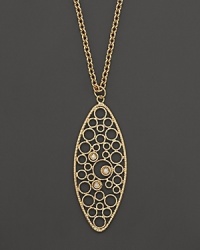 Faceted diamonds set in a 18K yellow gold pendant. By Roberto Coin. Faceted diamonds set in a 18K yellow gold pendant. By Roberto Coin.