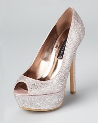 Covered in dazzling rhinestones, these shimmering STEVEN BY STEVE MADDEN pumps offer sparkling, standout style. Covered in dazzling rhinestones, these shimmering STEVEN BY STEVE MADDEN pumps offer sparkling, standout style.
