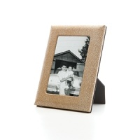 Supple shagreen-embossed fine Italian leather wraps this handcrafted frame in true luxury. A sturdy easel and easy access to photos makes it equal parts form and function. Supple shagreen-embossed fine Italian leather wraps this handcrafted frame in true luxury. A sturdy easel and easy access to photos makes it equal parts form and function.