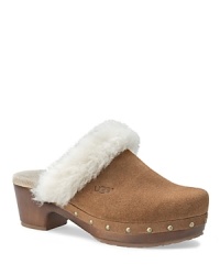 UGG® Australia updates this 70's-inspired clog with faux fur trim, rivets along the sides and a rugged rubber sole. UGG® Australia updates this 70's-inspired clog with faux fur trim, rivets along the sides and a rugged rubber sole.