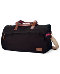 Jet-setter style with a preppy personality. Tommy Hilfiger's duffel bag will be your perfect travel companion, fitting all you need in one sleek design. Jet-setter style with a preppy personality. Tommy Hilfiger's duffel bag will be your perfect travel companion, fitting all you need in one sleek design.