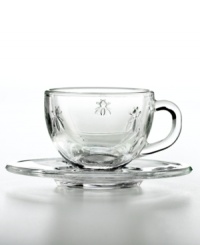 This whimsical glassware is abuzz with French history. Inspired by a travel set owned by Napoleon and the country's official coat of arms, each crystal-clear espresso cup and saucer is embossed with France's beloved bee. This whimsical glassware is abuzz with French history. Inspired by a travel set owned by Napoleon and the country's official coat of arms, each crystal-clear espresso cup and saucer is embossed with France's beloved bee.