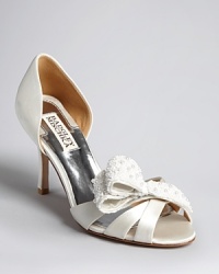 Bride to be or wedding guest, evening expert Badgley Mischka delivers the perfect open toe pumps with d'Orsay details and stunning, faux pearl-encrusted bows. You will wear them well beyond the big day. Bride to be or wedding guest, evening expert Badgley Mischka delivers the perfect open toe pumps with d'Orsay details and stunning, faux pearl-encrusted bows. You will wear them well beyond the big day.