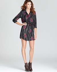 Office chic is simple with this classic Aqua shirt dress, updated in the season's must-have ikat print. Office chic is simple with this classic Aqua shirt dress, updated in the season's must-have ikat print.